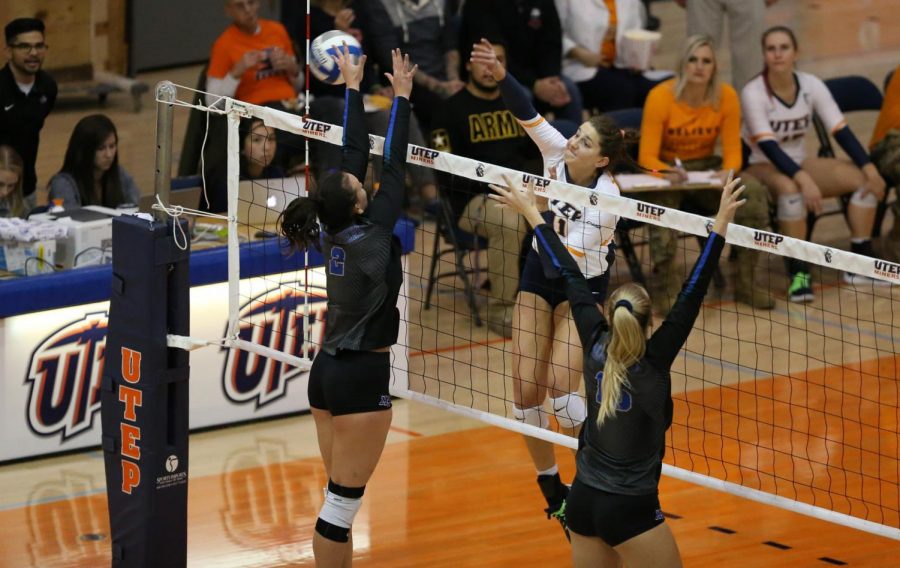 Senior right-side hitter Cheyanne Jones strikes the ball over a  Blue Raider defender against Middle Tennesee State Oct. 18, 2019.