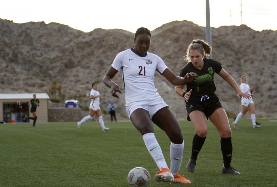 UTEP sophomore Ayana Noel fends off a Wolverine player in a defensive battle against Utah Valley Feb. 13.
