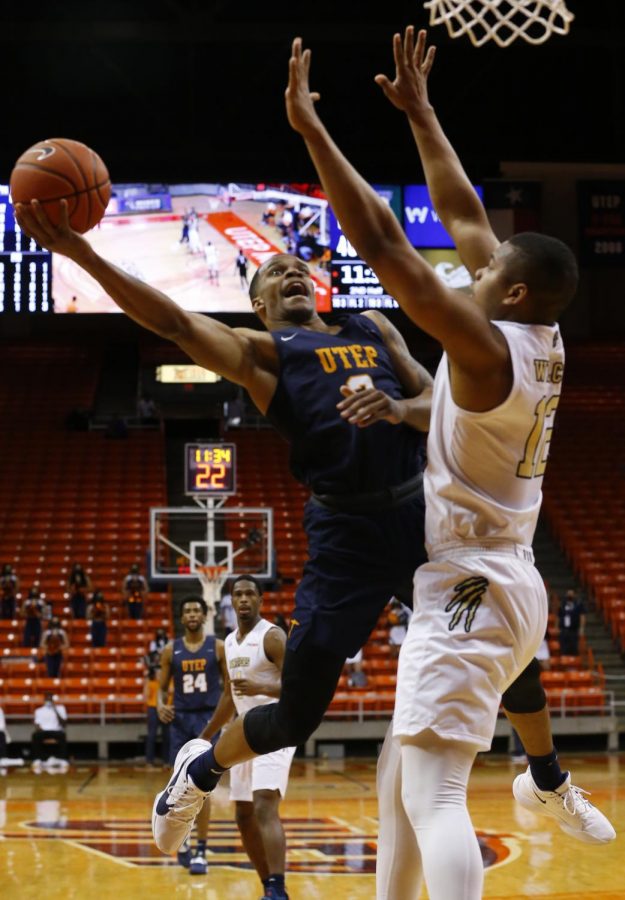 UTEP+junior+guard+Christian+Agnew+drives+hard+to+the+basket+versus+Florida+International+drawing+a+foul+Feb.+13.