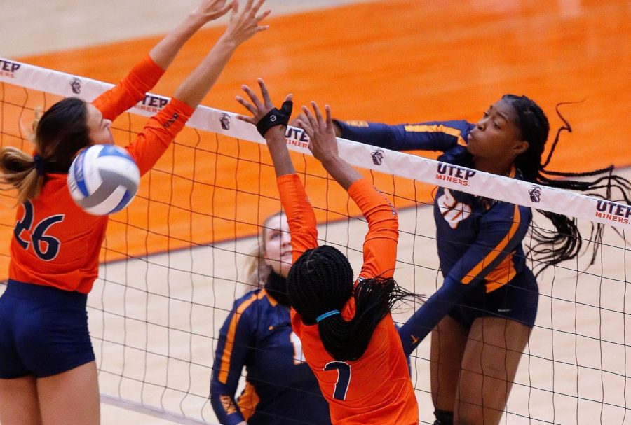 Junior+Serena+Patterson+spikes+the+ball+over+the+net+for+a+kill+against+UTSA++Feb.+23.