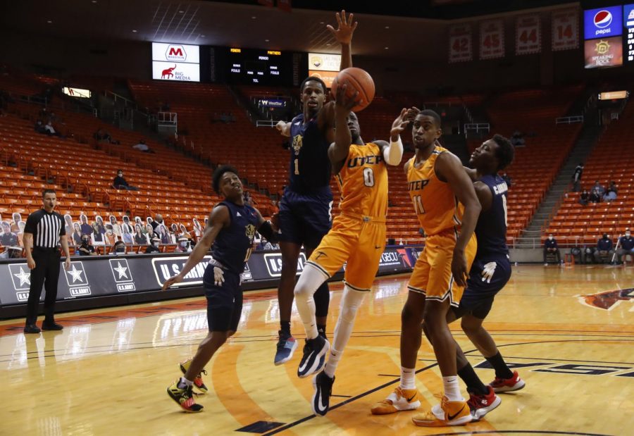 UTEP+junior+guard+Souley+Boum+drives+to+the+basket+in+traffic+versus+Florida+International%2C+Feb.+13.