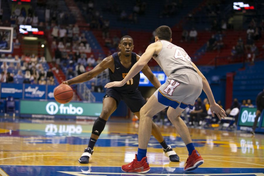 Senior Bryson Williams tries to work past a Kansas defender March 4.