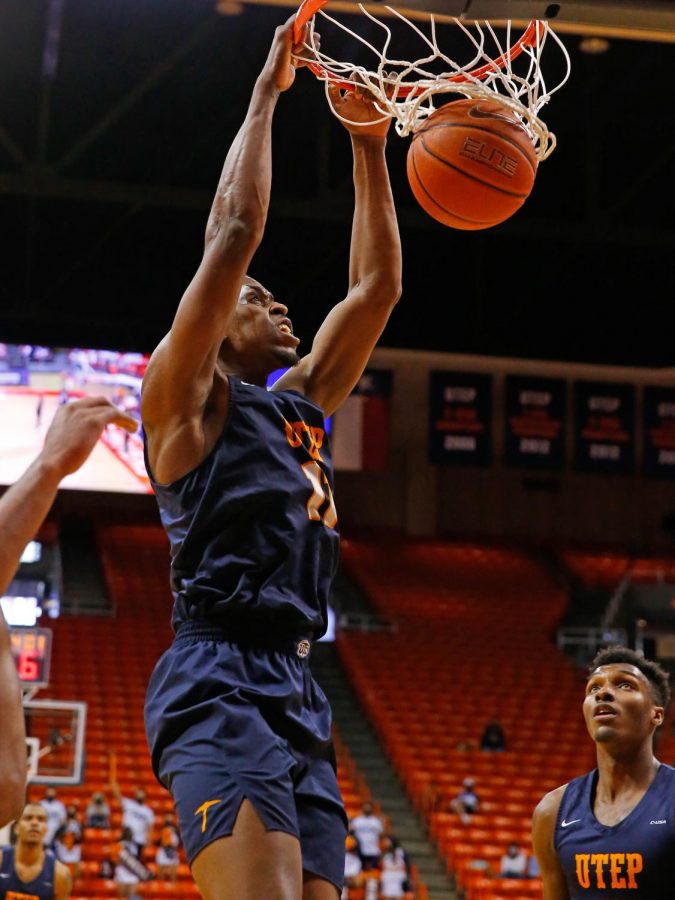 Senior center Bryson Williams slams down a monster dunk versus Charlotte in the last home game of the season Feb. 28.