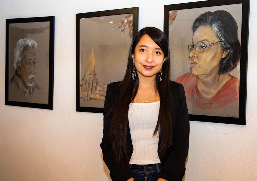 Jaqueline Martinez stands in front of her art work featured at Casa Ortizs Last Thursdays event on Feb. 25, 2021.