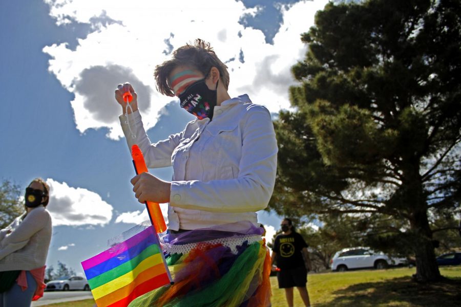 Cal Spencer plays with their friends at the Borderland Rainbow Center's rally in support of the transgender community on Saturday, March 27, 2021 at Memorial Park. 