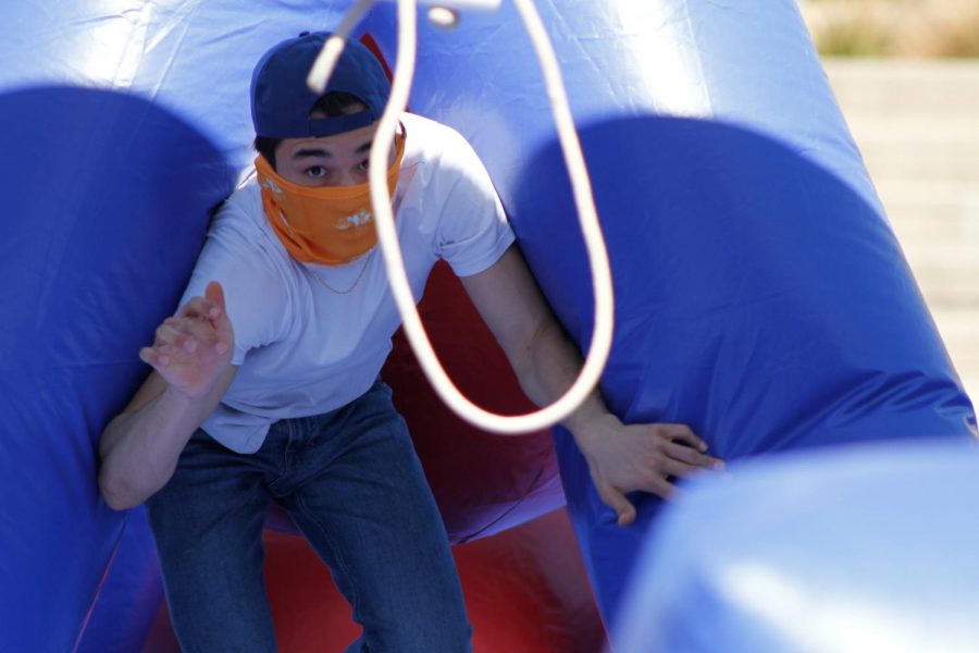 Fernando Rivera comes out from an obstacle game ready to jump over the swing at Centennial Plaza on March 30, 2021, as part of UTEPs in-person Field Day. 