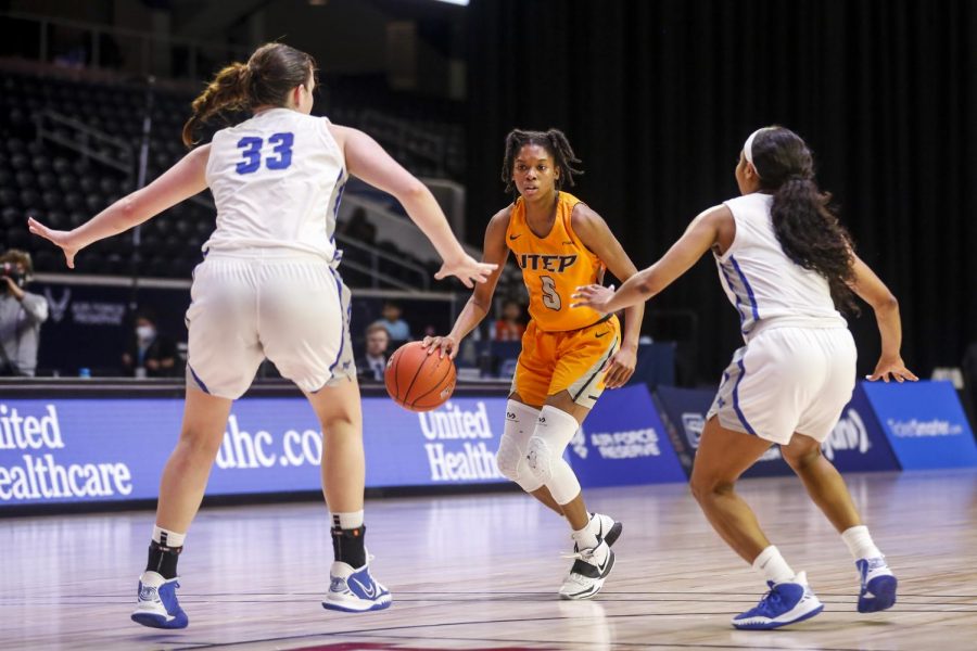 Junior guard Destiny Thurman  looks for an opening with two Blue Raider defenders closing down the down in a loss to MTSU March 12.