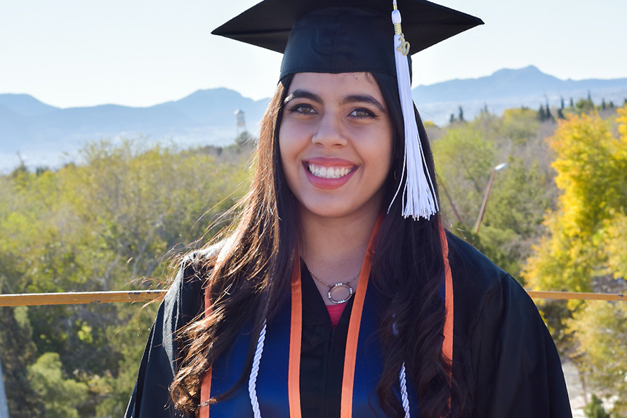 Aylin Duarte, 21, the newest recipient of the Fulbright award, who will be graduating in her graduation’s cap and gown in Spring 2020.