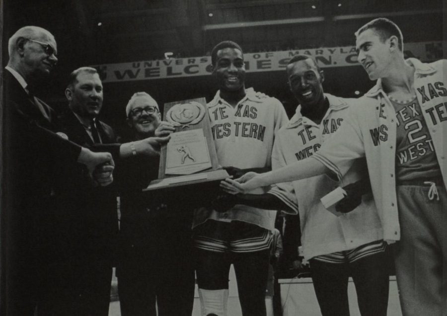 Members of the 1966 Texas Western national championship team accept the championship trophy.