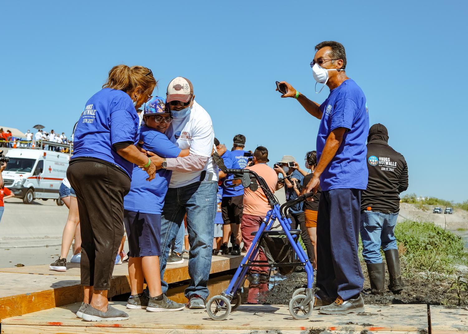 Families+separated+by+U.S.-Mexican+border+reunite+for+three+minutes+at+%E2%80%98Hugs%2C+Not+Walls%E2%80%99