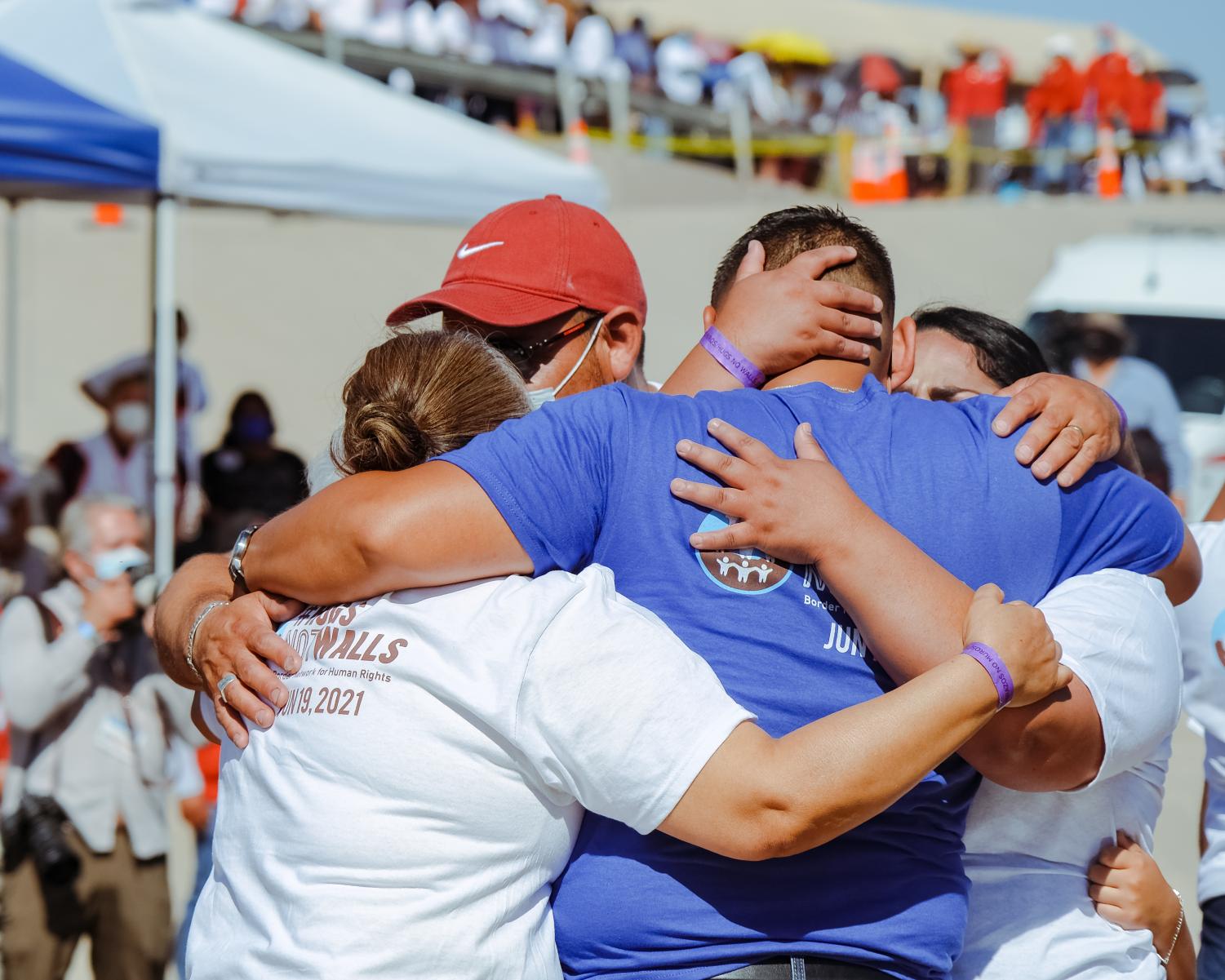 Families+separated+by+U.S.-Mexican+border+reunite+for+three+minutes+at+%E2%80%98Hugs%2C+Not+Walls%E2%80%99