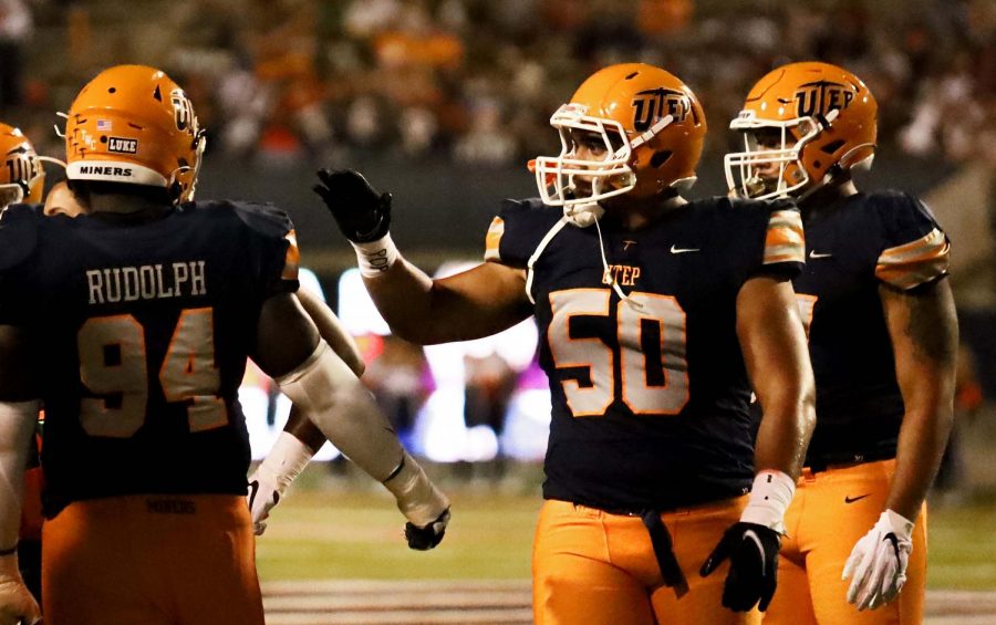 Tevita Tafuna high-fives Jalen Rudolph after a play at the B-CU game Sept. 4, 2021.