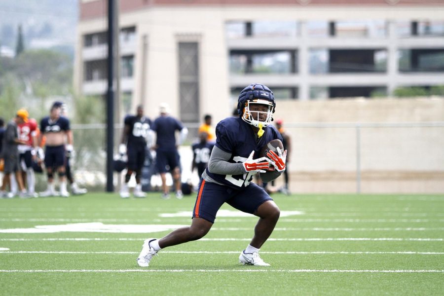 Walter Dawn Jr. catches a punt kick during practice on August 16, 2021