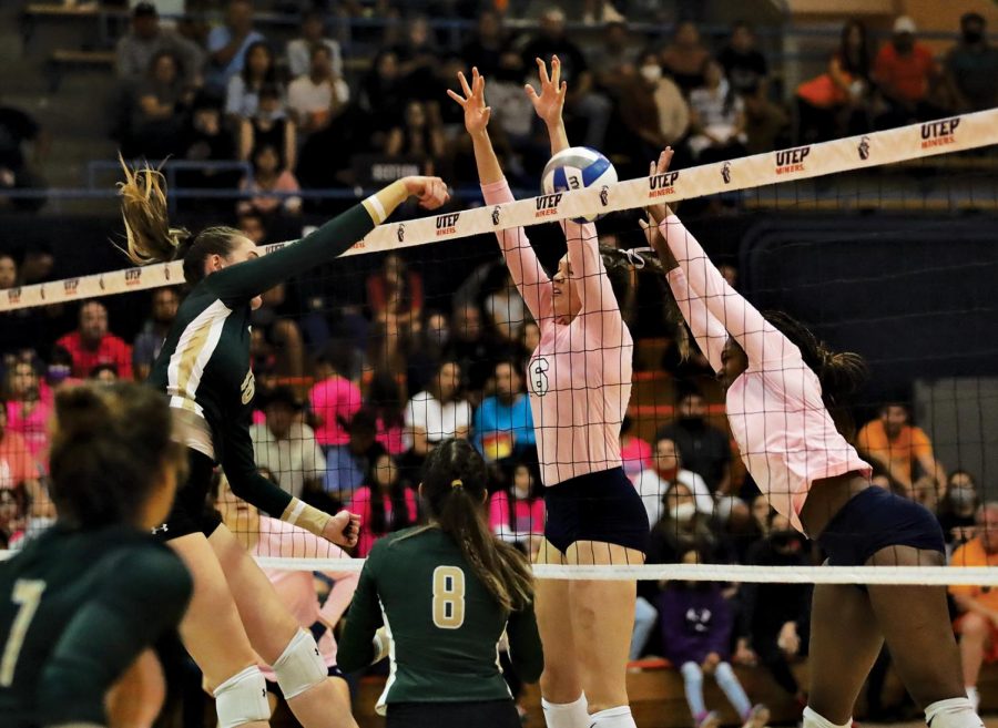 Outside Hitters Torrance Lovesee and Serena Patterson block the ball during the game against the University of Alabama at Birmingham on Oct.22. 