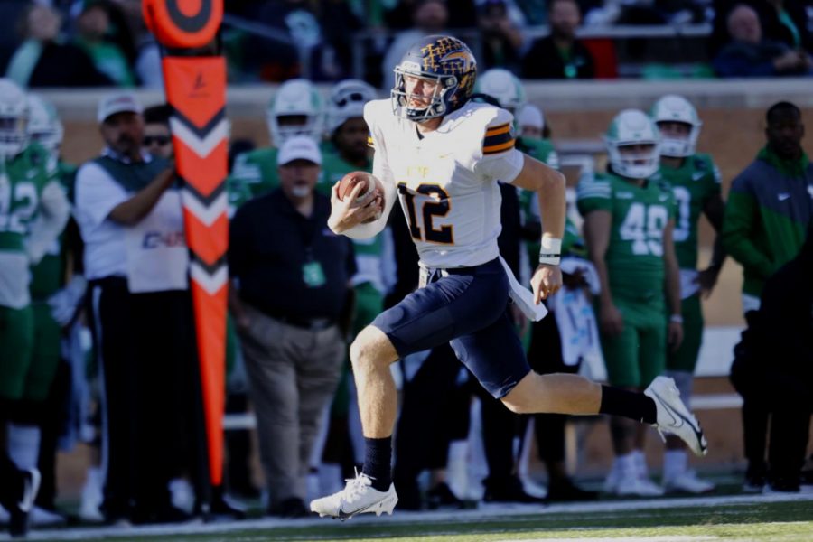 Gavin Hardison runs the ball against UNT on Nov.13, 2021, at Apogee Stadium  
Photo by: Ivan P. Aguirre 