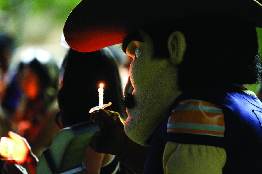 Paydirt Pete holds a candle at the ceremony of life for Dr. Diana Natalicio on Oct. 27, 2021 