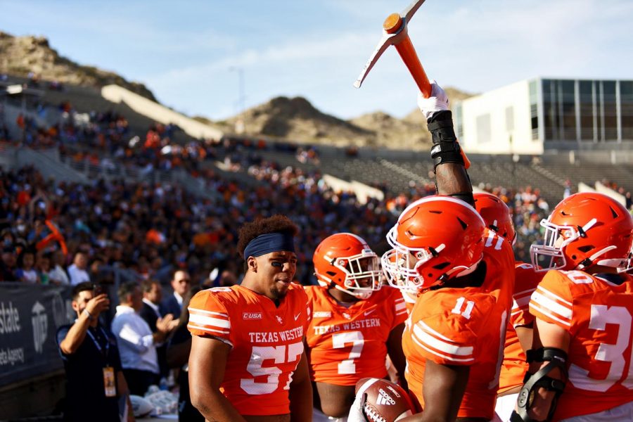 Freshman wide receiver Khalil Warfield cheers with fans and players on the sidelines after a touchdown during the football game against Rice University at the Sun Bowl on Nov. 20.