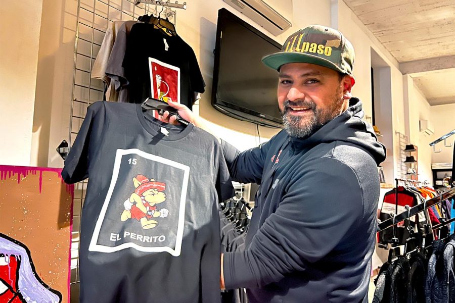 Graphic Designer of Loteria Del Chuco, Daniel Corral, shows off his self-designed merchandise inspired by El Paso’s Loteria game version.  