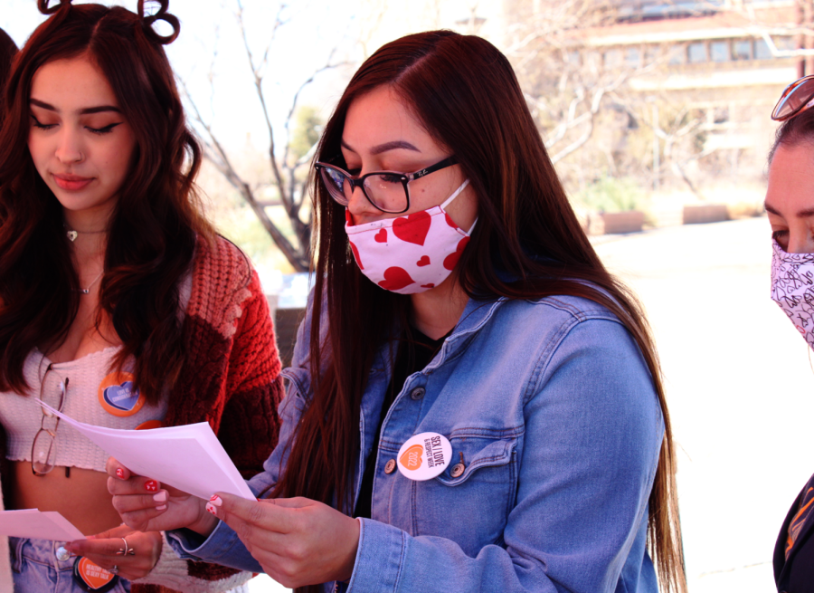 Jessica Ruiz asks true or false questions to students who participate at the Sex/Love and Respect booth at Centennial Plaza Feb. 14. 