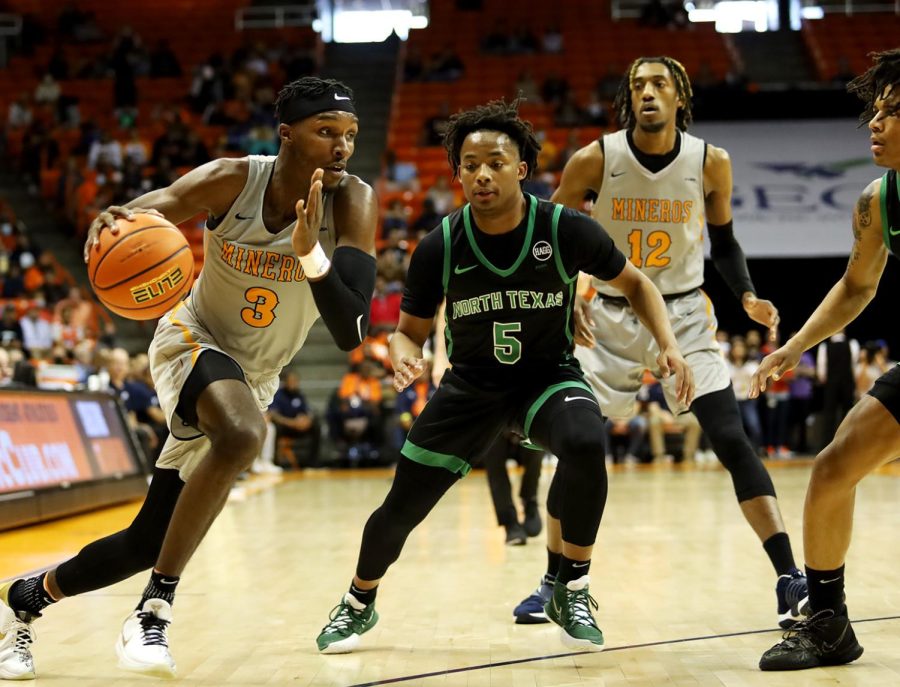 Guard Keonte Kennedy dribbles past UNT players. 