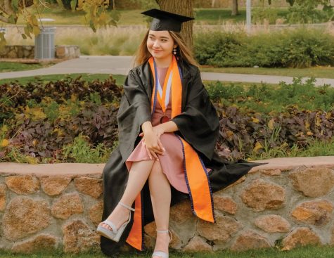 Monica Enriquez posing during her graduation photoshoot, May 2021. 
