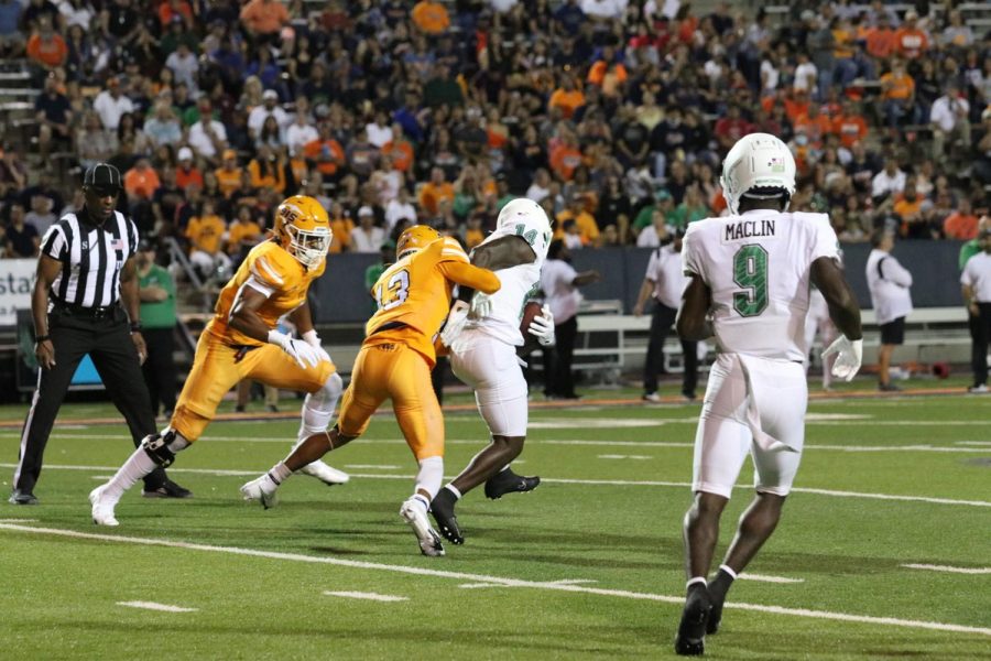 The UTEP secondary strugglesto stop the opposing team as North Texas drives down field. 