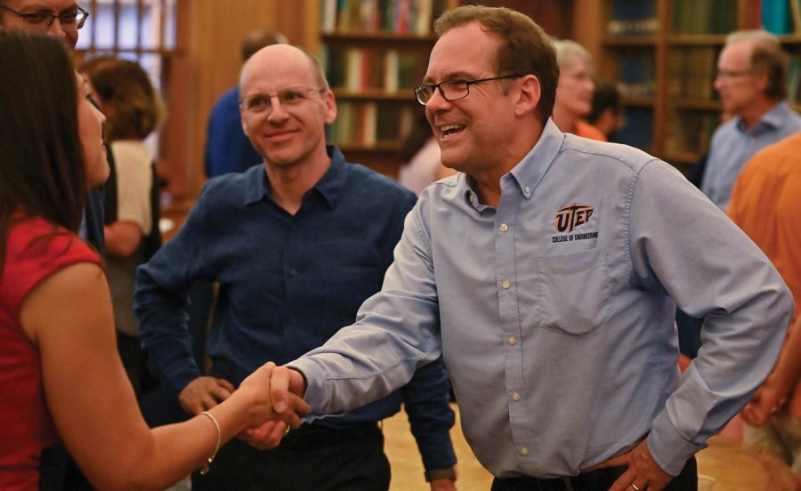 : New dean of the College of Engineering, Kenith Meissner, shakes the hand of an attendee at the Meet the Dean” ice cream social from 4:00 p.m. to 6 p.m. Aug. 28 in the Geology Reading Room.