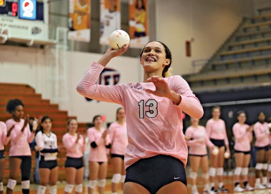 Outside+hitter+Paulina+Perez+Rosas+throws+a+toy+volleyball+out+towards+the+crowd+during+senior+night+Dec.+2%2C+2021.+The+Prospector+File+Photo
