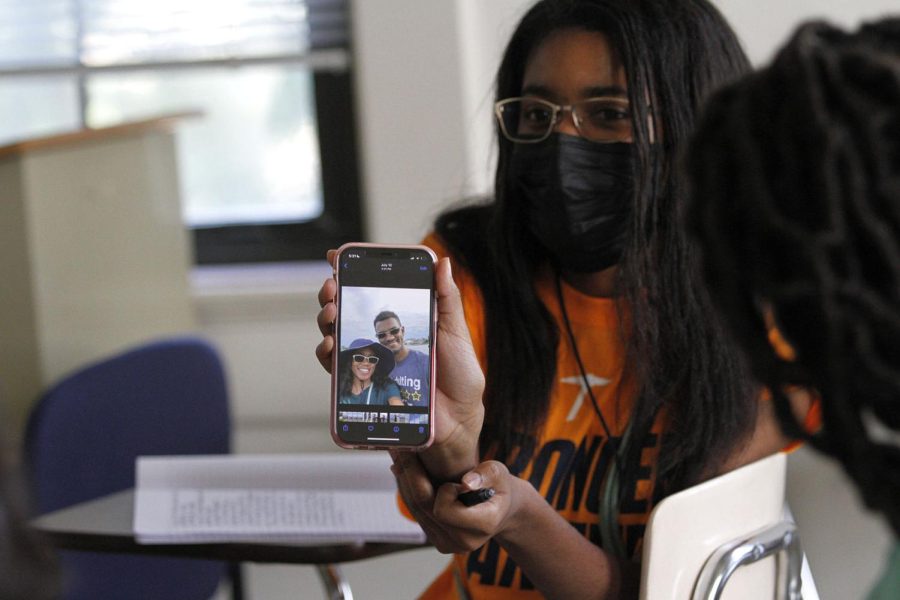 A member of NAMI shares a photo of her and her brother during a writing workshop held Sept. 2 