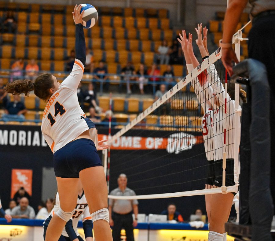 Outside hitter Ema Uskokovic jumps to tip the ball over the net during a game against South Dakota Sept. 3.