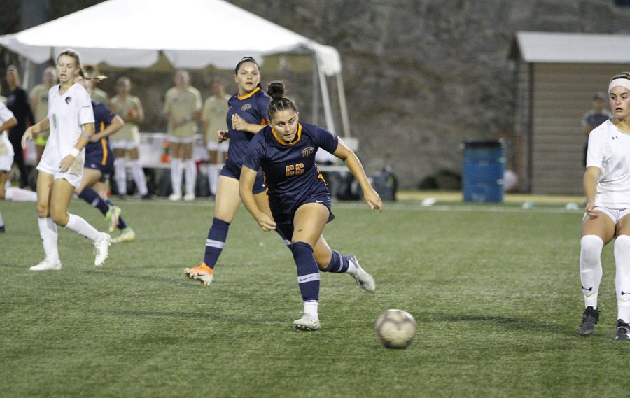 Forward Tessa Carlin chases after a UAB defender on Sept. 30 at University Field.