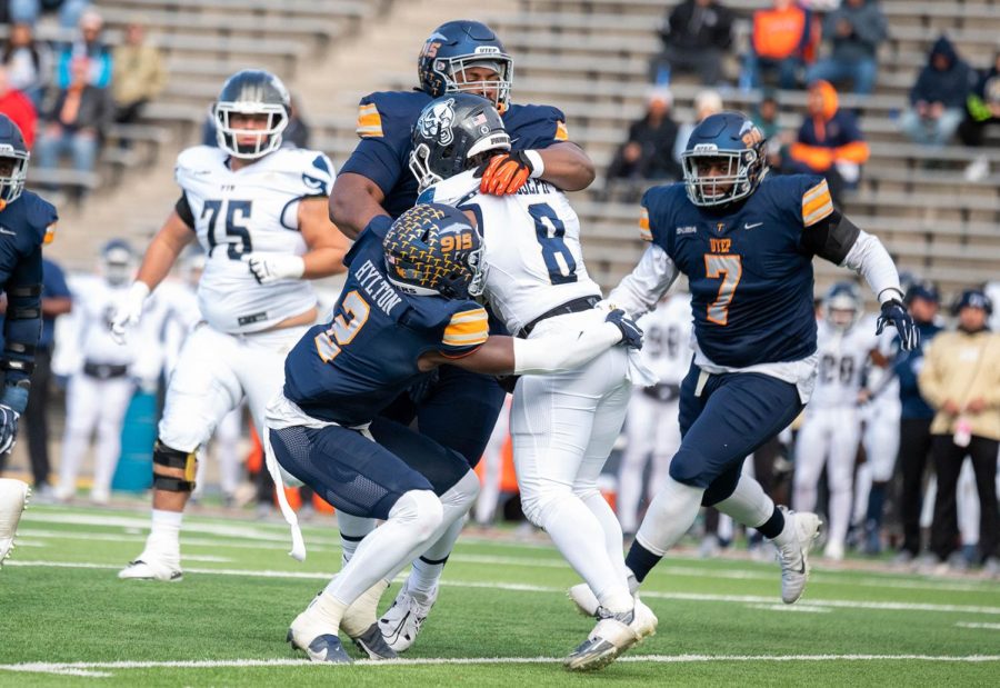 Sophomore safety Kobe Hylton, with the help of his teammate, tackles the ball carrier during a game against FIU, Nov. 19.  