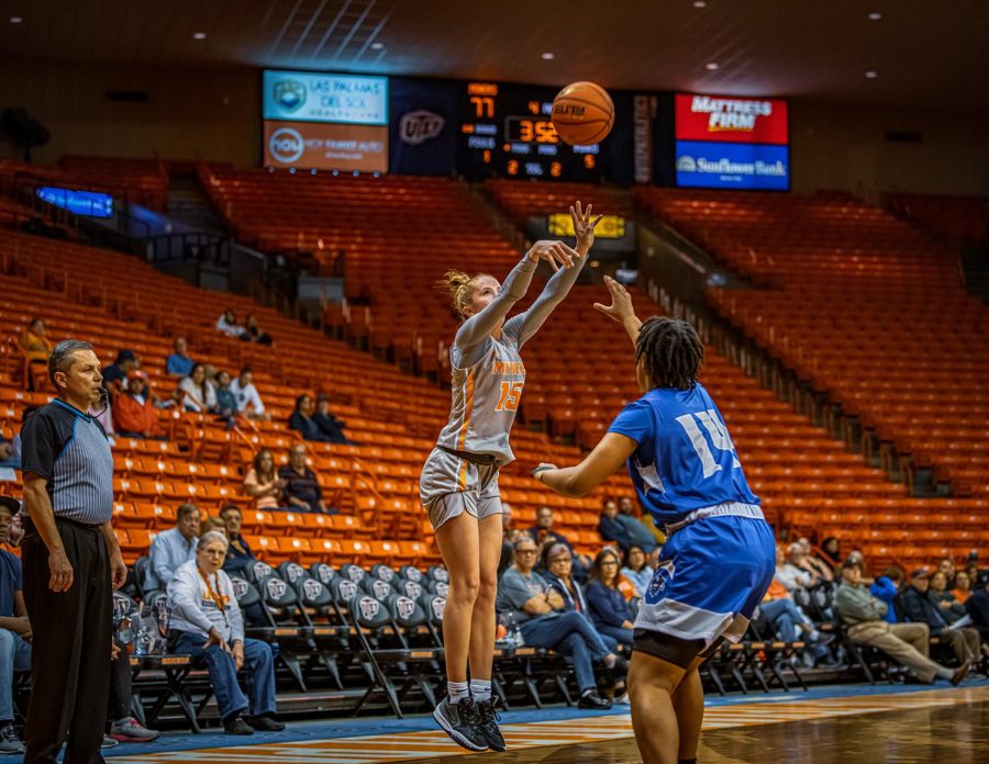 Junior guard Avery Crouse takes a three-point shot from the corner to pile onto the lead.