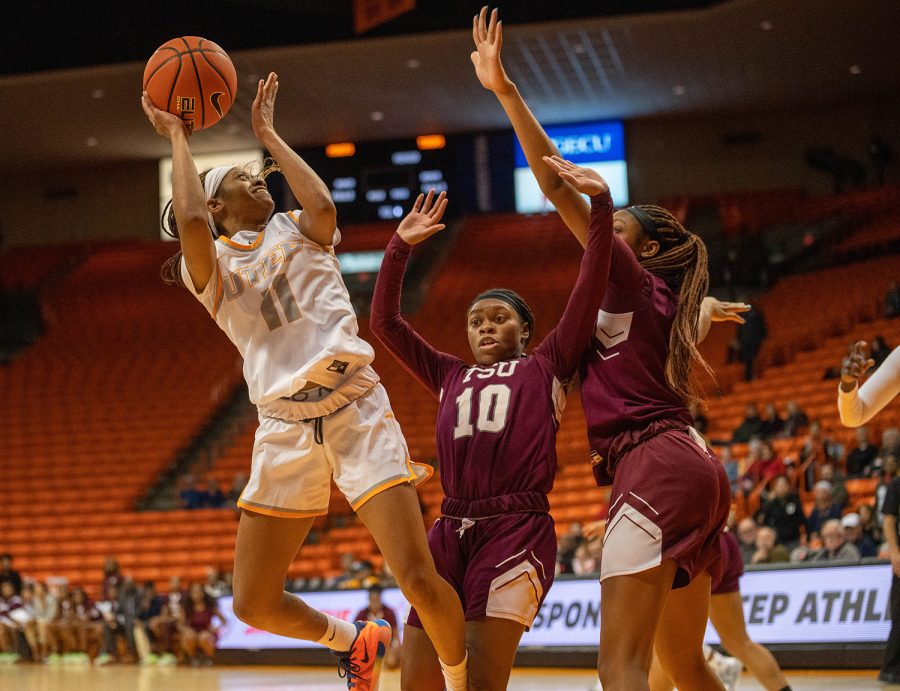 Guard N’Yah Boyd attempts to shoot the ball while being defended. 