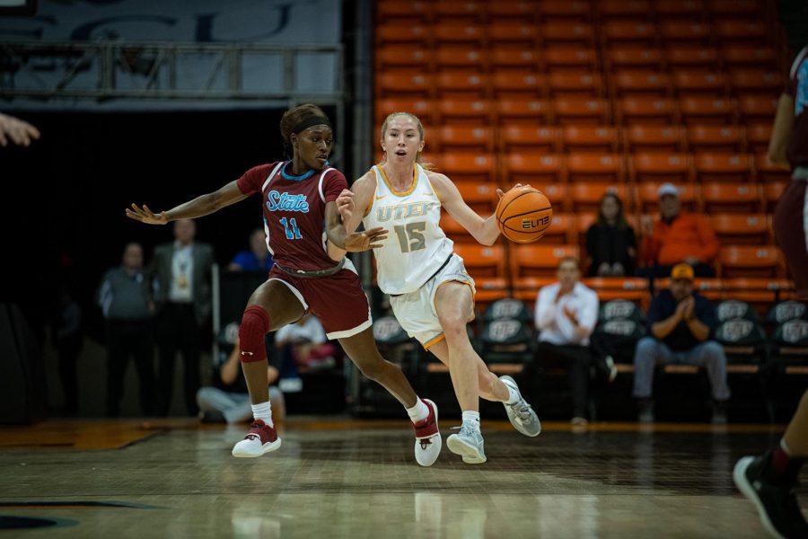 Junior guard Avery Crouse drives down the court with the Aggie defender pressing.
