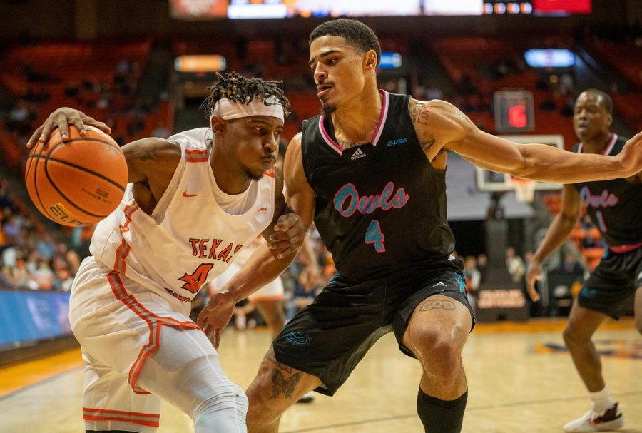 Guard Mario McKinney Jr dribbles the ball along the baseline during the game against FAU. 