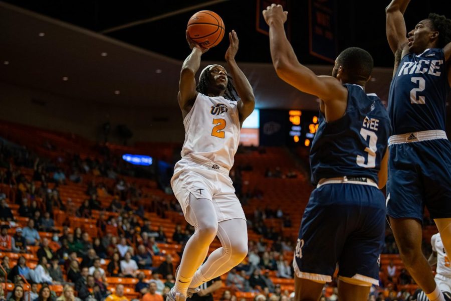 Junior guard Tae Hardy with a jumping floater over two Rice defenders.