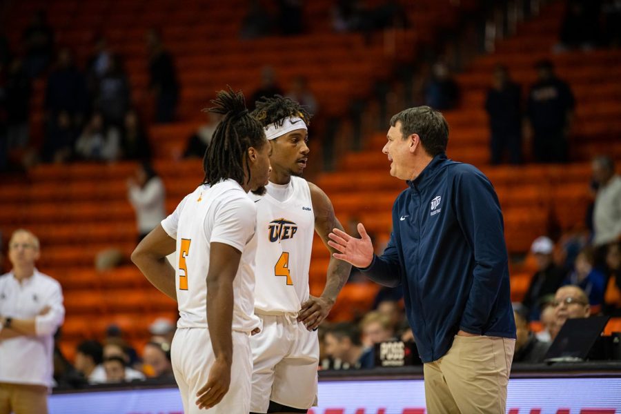 Coach Joe Golding gives instructions to junior guard Mario McKinney Jr. And senior guard Shamar Givance after they forced overtime.