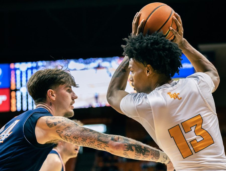 Calvin Solomon plays offense against UTSA player. 