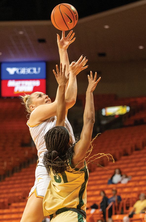 Forward Elina Arike reaches for the ball as a University of North Carolina at Charlotte player also goes for it at the Don Haskins Center Jan. 16.  