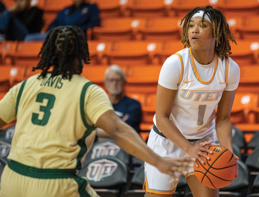 Guard Jazion Jackson plays offense against Tamia Davis from Charlotte.  