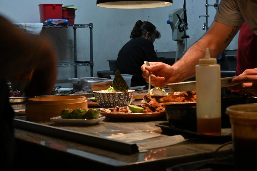 A Chef adds food to the plate as part of the dish. Socorro, Tex. Thursday, Feb. 2, 2023. 