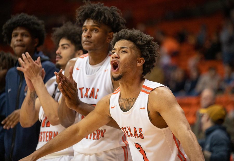 Guard Malik Zachery cheers his teammates on during a game against Charlotte.