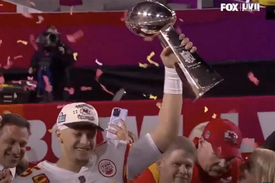 Kansas+City+Chiefs+quarterback+Patrick+Mahomes+holds+up+their+Super+Bowl+LVII+trophy+after+their+win+against+the+Philadelphia+Eagles.+Photo+courtesy+of+FOX+Sports+