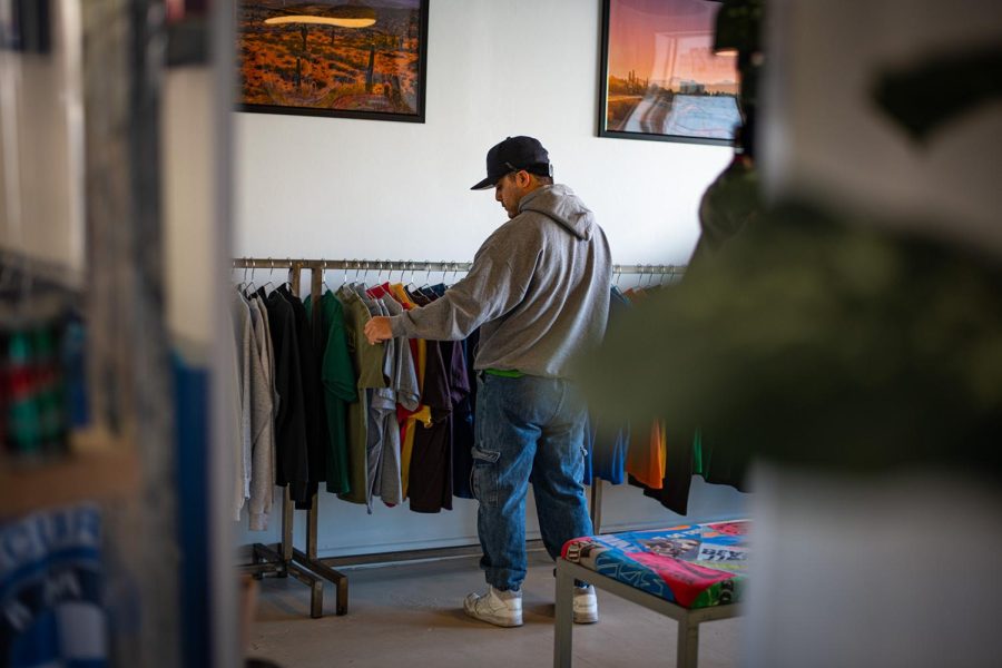 A client looks through the assorted clothing for sale, at Vintage store located at 2727 N. Stanton St.  