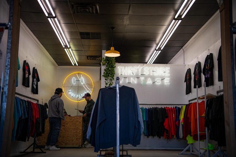 A wide shot of the THRFT store showing racks of clothing offering brand name products.