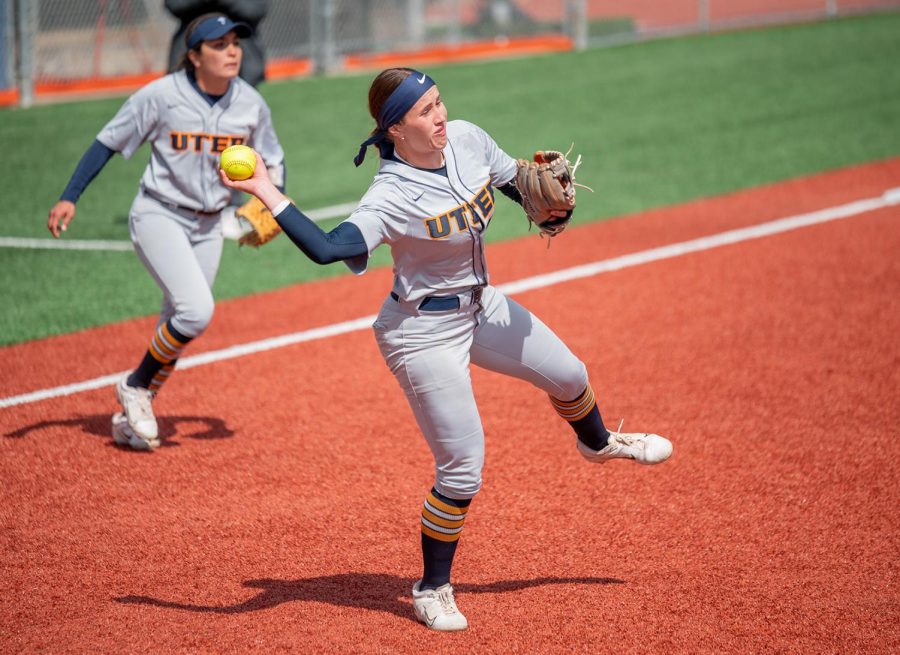 Infielder Pate Cathey attempts to throw the ball towards first base during a game against WKU. 