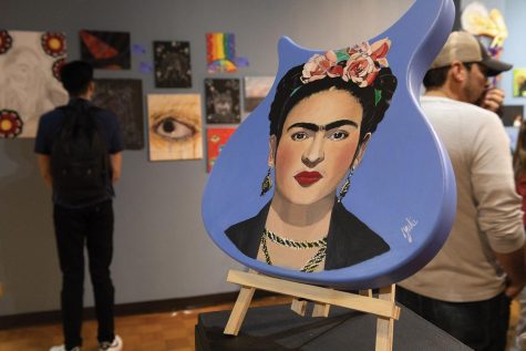 Artist Jacki Downing, a graphic design student, painted Frida Kahlo on a guitar. 