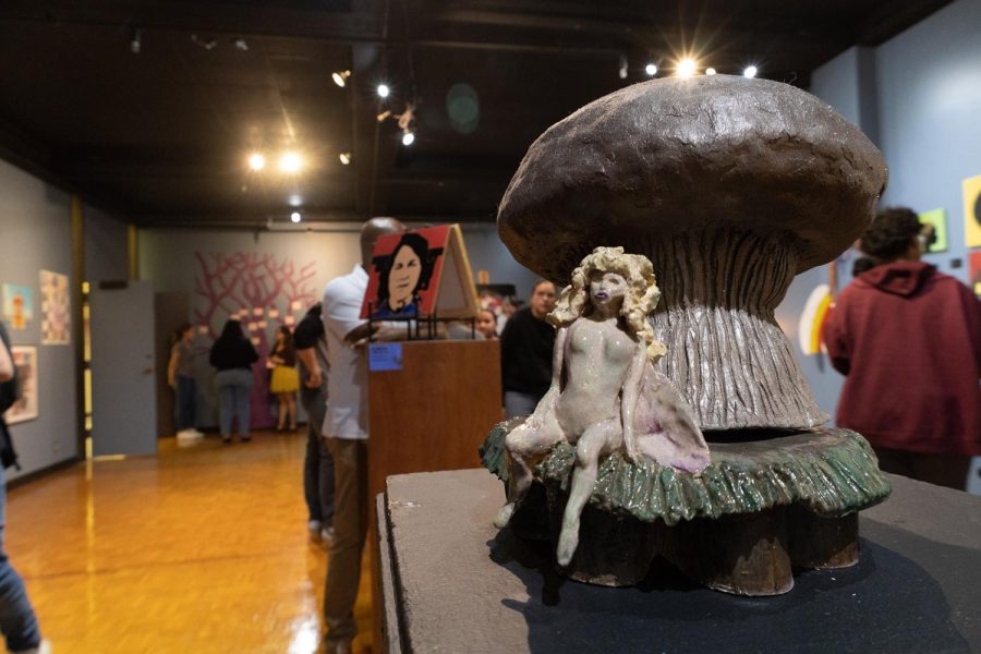 Artist Margaret DeAnn Johnston-Barber, UTEP Art Student, has her mushroom and fairy realm sculpture on display.  