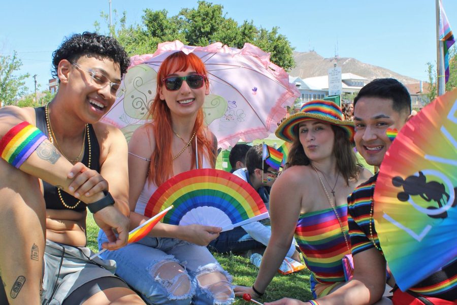 Friends gathered around to celebrate the pride picnic after the pride parade. 